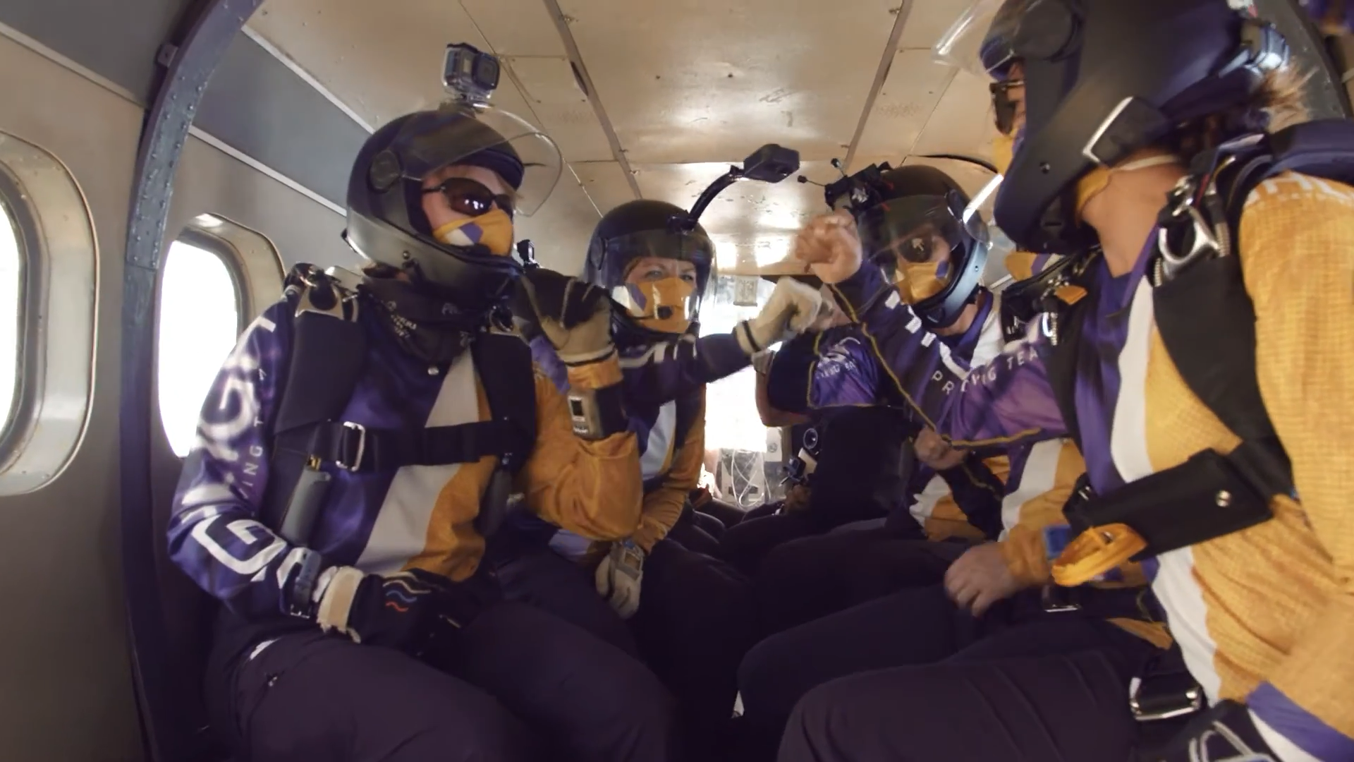 Interior inside a plane high five with Team Highlight Skydiving Team