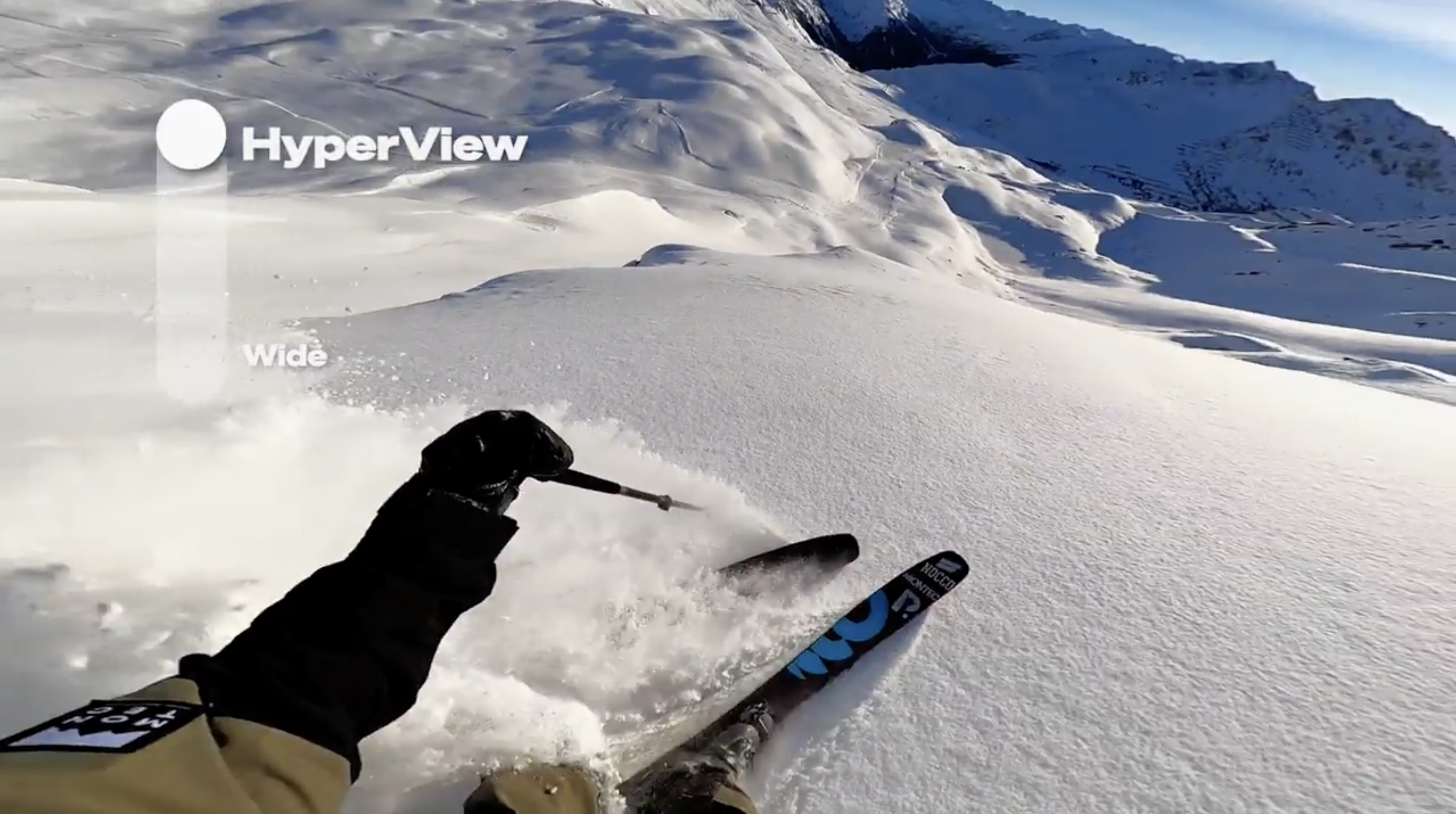 Skier skiing powder with GoPro Animation Graphic shows HyperView selection on screen display GoPro