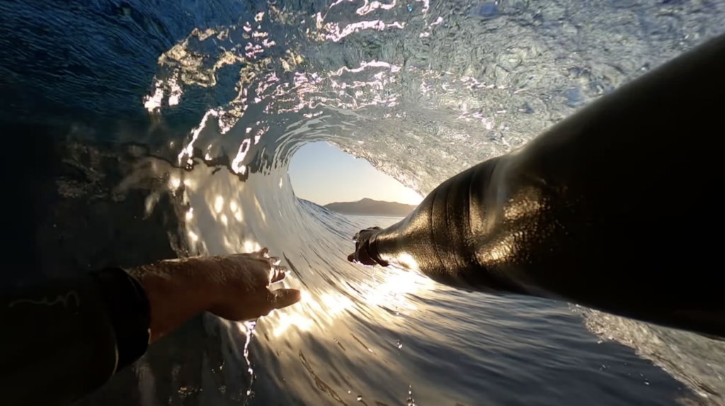 Surfer using the GoPro Bite Mount in a tube