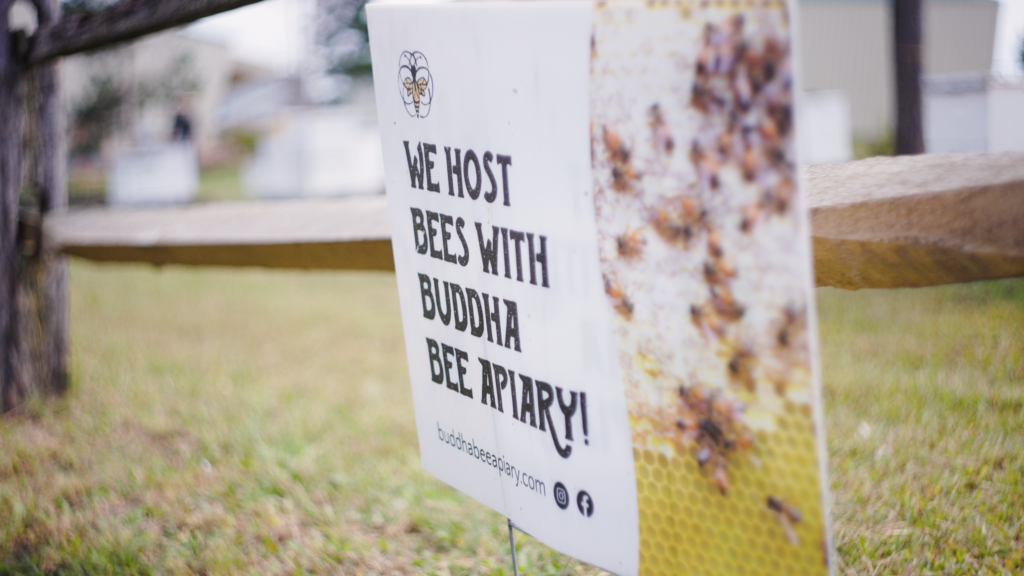 lawn advertisement lawn sign advertising Buddha bee apiary. We Host Bees with Buddha Bee Apiary
