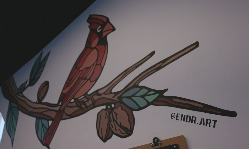 ENDR ART paints a cardinal mural for WELD Wine and Beer Graphic art Hand painted mural Ian Johnson Full Circle Streaming & Digital 